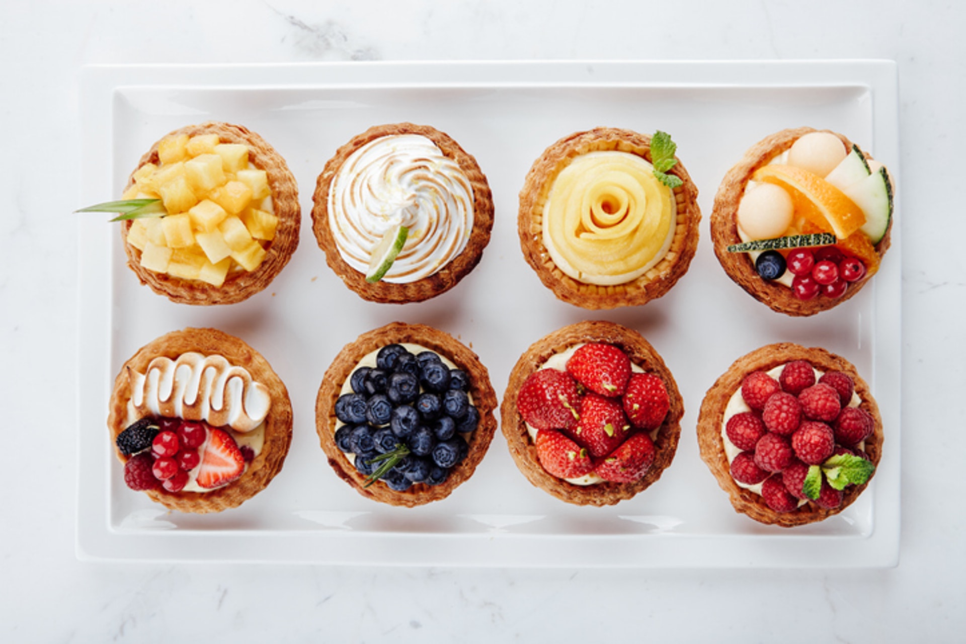 4.【果撻】(最高脂) 水果撻雖然含有營養豐富的水果,但製作過程中,都會添加糖分,餅底亦會含有不少牛油和忌廉或吉士醬,全部屬於高糖分及高脂肪食材。(GettyImages/VCG)