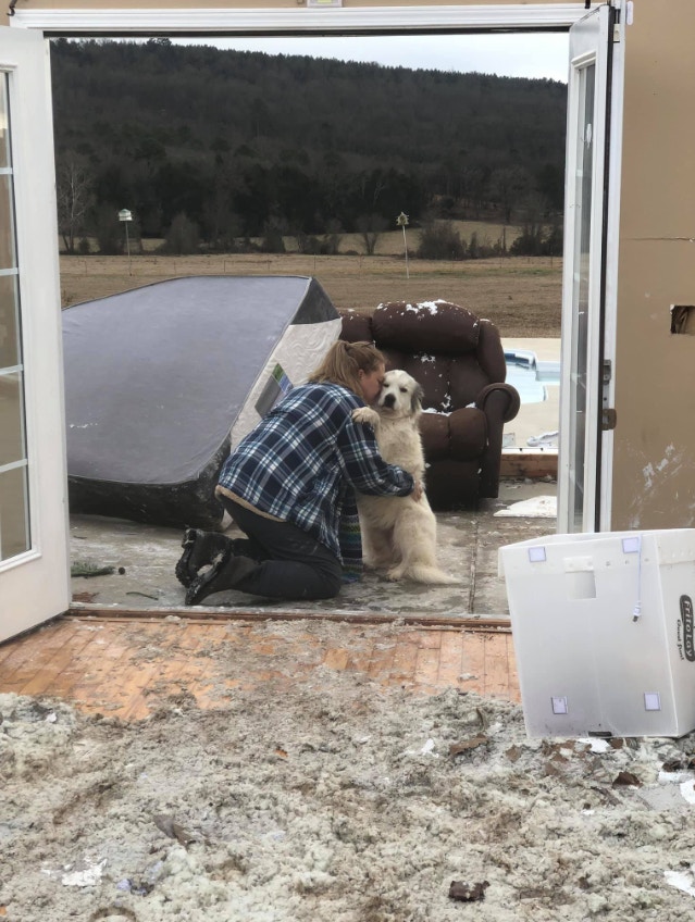 Ona saw her dog and hugged it excitedly. (Julie Moore)