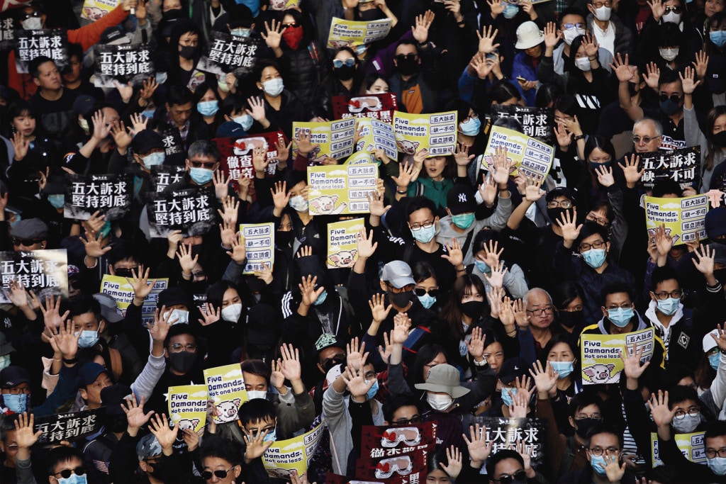 一年過後，五大訴求終究實現了多少？圖為去年12月8日民陣舉辦國際人權日遊行。（資料圖片／盧翊銘攝）