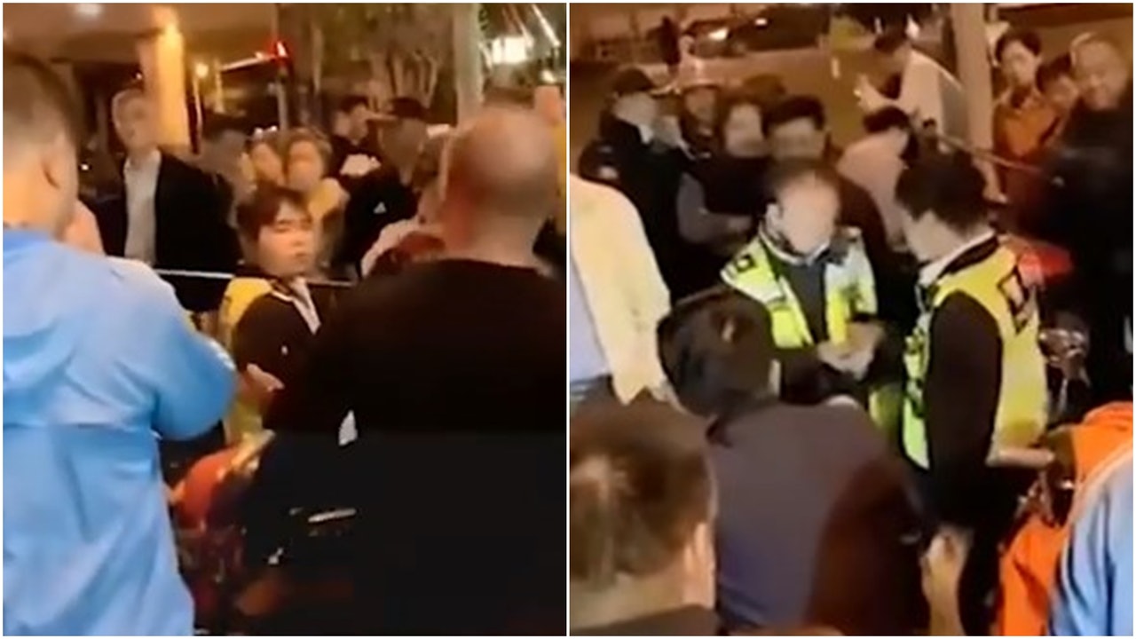 上海兩身高五呎男着反光衣冒警 遭市民揭穿後被公安傳喚 上海兩身高五呎男着反光衣冒警 遭市民揭穿後被公安傳喚