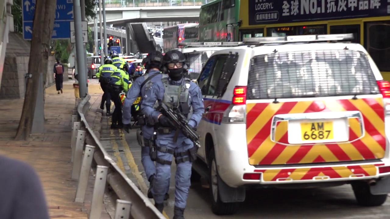 壹傳媒六前高層出庭 警方反恐特勤隊荷槍戒備 金鐘道一度封閉 壹傳媒六前高層出庭 警方反恐特勤隊荷槍戒備 金鐘道一度封閉