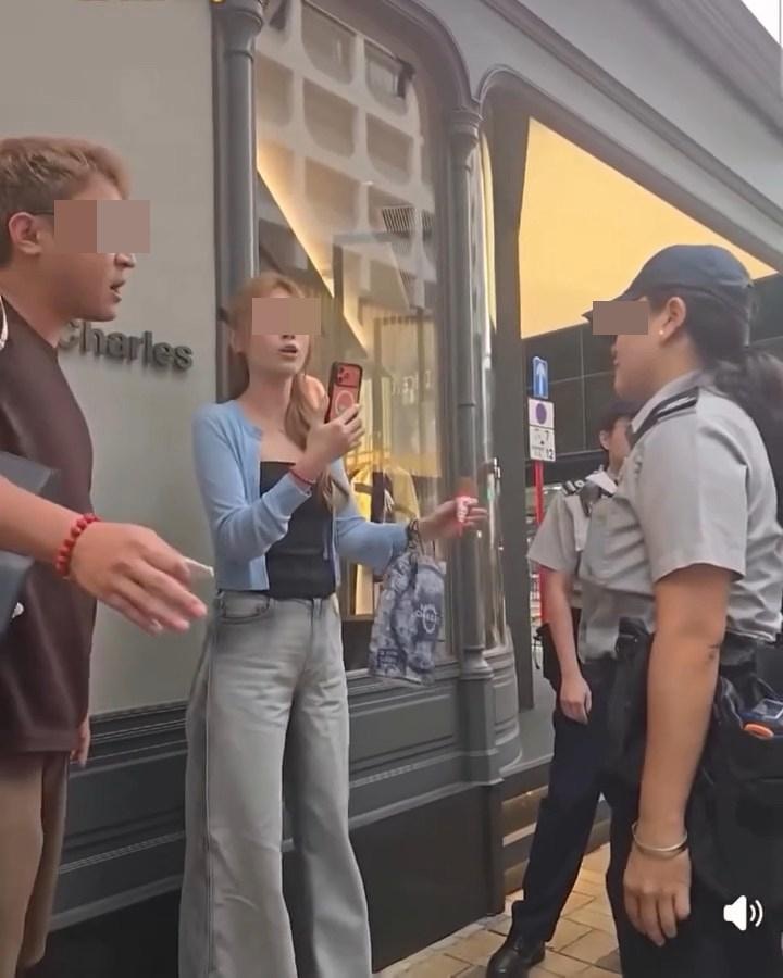 尖沙咀廣東道有1對男女遊客隨地亂丟煙頭「斷正」，被食環署人員開罰單，但2人拒絕出示身份證明文件，還取出手機反拍食環署人員。（Facebook影片截圖）